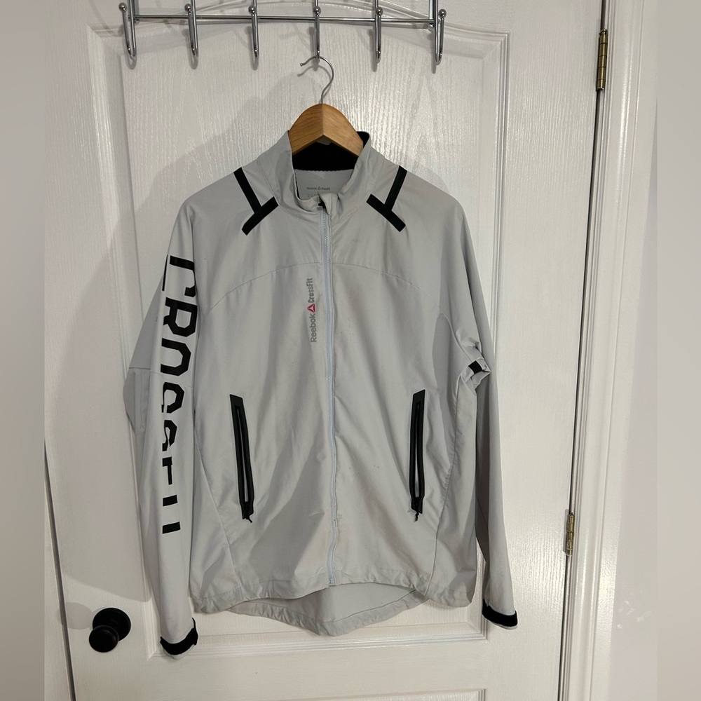 Reebok Santa Cruz crossfit jacket.  Lightweight, light grey and black.